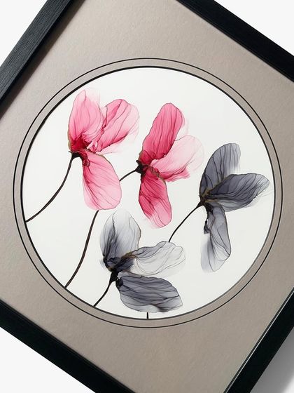 A full view of one of the floral pieces. The round mat perfectly contains the artwork, creating a focal point that is both modern and timeless.