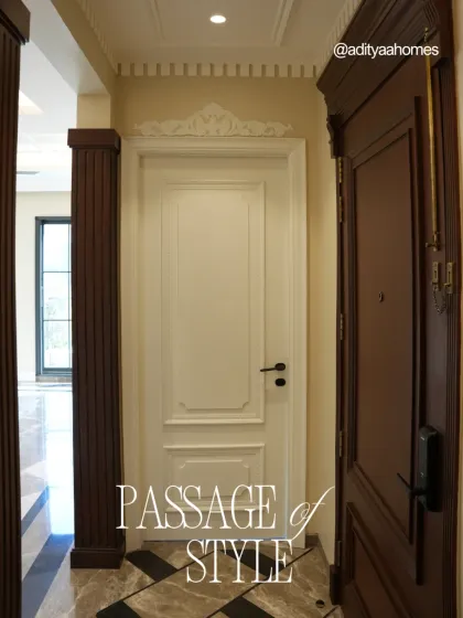 Every journey through the home should feel special. This passage, with its custom-carved wooden main door and clean, classic interior door, sets a tone of elegance and style from the moment you step inside.