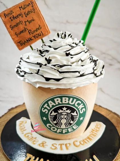A cake that looks just like a Starbucks Frappuccino! This was a fun corporate thank you cake, complete with the iconic green logo and whipped cream topping.