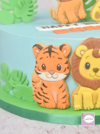 A close-up of the adorable tiger cookie from the animal-themed cake.
