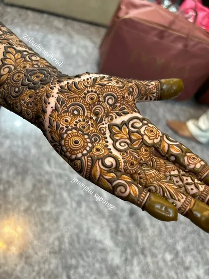 The beautiful palm design for engagement bride Zoya. The pattern is dense with roses and swirls, creating a rich and celebratory look.