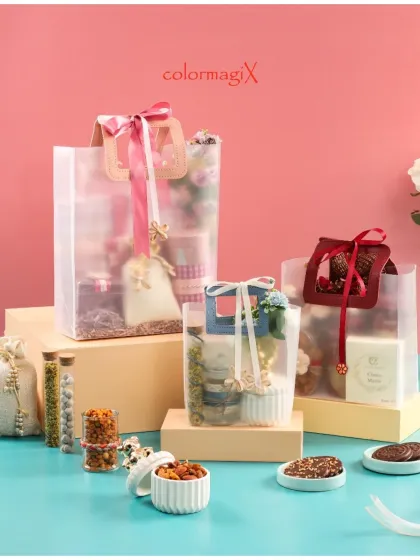 A collection of our frosted PVC gift bags in various sizes, adorned with colorful ribbons. This is a contemporary and stylish way to present festive or wedding favors.