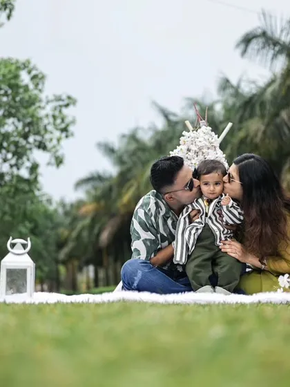 A heartwarming family moment during an outdoor photoshoot. Our picnic setup provides a comfortable and beautiful space for families to interact naturally for the camera.