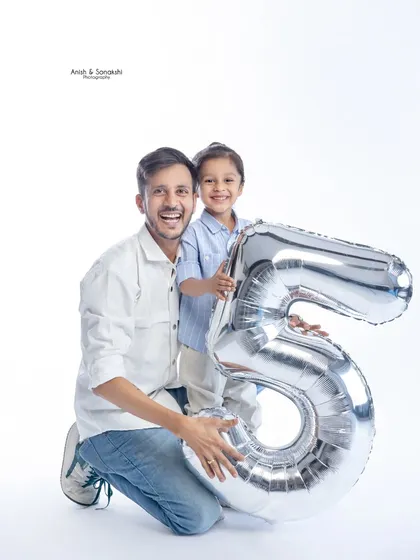 Celebrating a fifth birthday with dad! Including parents in milestone photos makes the memories even more special.