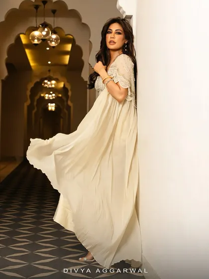 A side profile of Chitrangda Singh in the Alauren Cape Set, capturing the ethereal movement of the lightweight cape.