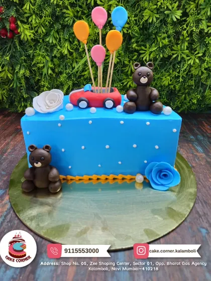 A fun teddy bear cake with a car and balloons. The two chocolate bears and bright blue frosting make it a cheerful choice for a child's birthday.