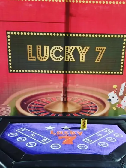 Another popular choice for our casino themed parties is the 'Lucky 7' game table. It comes with a themed backdrop and all necessary accessories for a fun night of games.