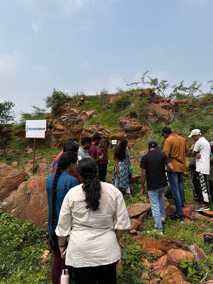 The Beumer Group team explores the rugged terrain of Aravali Nagar Van, identifying the perfect spots to plant 16 different varieties of native species.