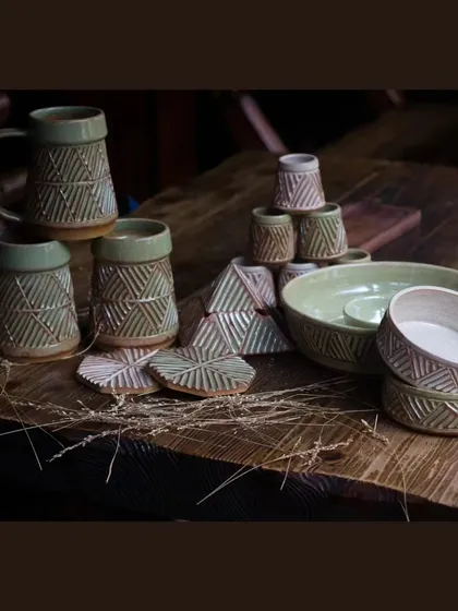 The full KHUMĀR collection, featuring beer mugs, shot glasses, bowls, and a chip and dip platter. It's everything you need to host in style.
