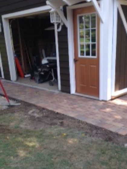 I also do practical hardscaping jobs, like this paver walkway I installed leading to the door of a shed. It keeps the entrance clean and mud-free.