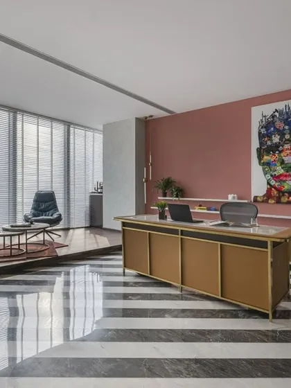 This 3,500 sq. ft. CEO office, located on the 35th floor in Mumbai, offers an incredible sea view and exudes both luxury and functionality. The striking diagonal stripes on the floor and the curated, private layout create a powerful environment for a leading petrochemical company.