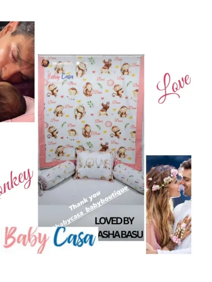 This monkey-themed bedding set was a special request, inspired by love. The design features playful monkeys and the word "Love" on the pillows, creating a sweet and personal nursery theme.