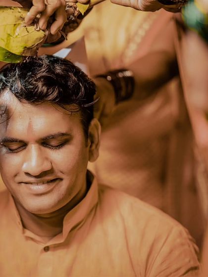 A serene moment as the groom receives blessings during his Haldi ceremony.