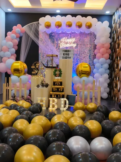 This angle shows the full effect of the balloon-filled floor and the shimmering backdrop. It’s a great example of how I can transform the space into a unique party room.