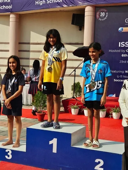 The view from the top. Here is our champion, Yuvika Sharma, standing proudly on the number one podium after winning three gold medals at the ISSO North India Swimming Competition. Moments like these are the culmination of countless hours of focused training and a winning mindset.