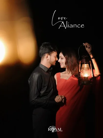 A beautiful portrait of a couple holding a lantern, with the warm light creating a soft, intimate ambiance.