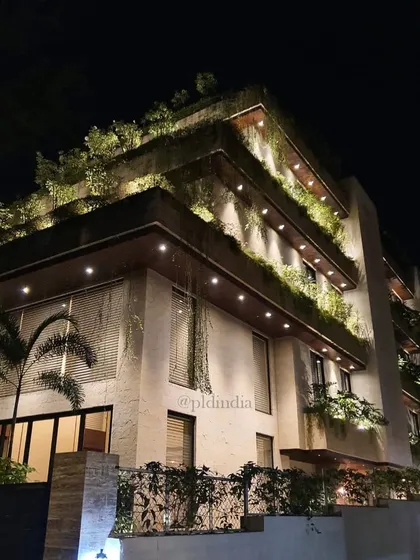 Our landscapes transform from day to night. For this Bandra residence, we used strategic lighting to illuminate the multi-level vertical gardens, turning the building into a glowing beacon of green against the night sky.