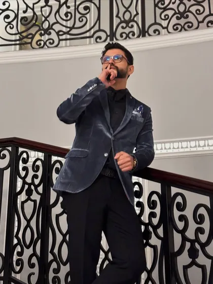 A thoughtful pose on the staircase, showing off the details of the formal look.