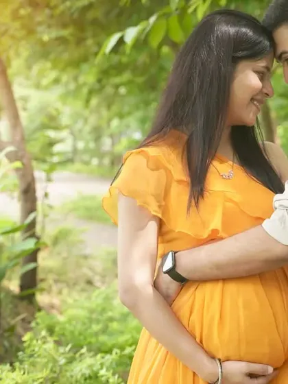 The tiniest shoes for the tiniest feet. This classic announcement pose is a sweet and emotional way to share the excitement of your growing family during an outdoor shoot.
