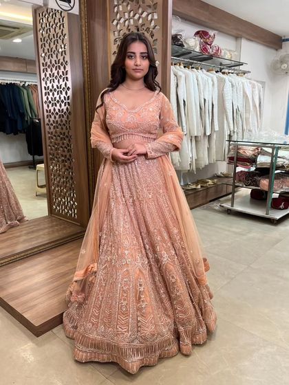 Another view of the full peach lehenga, a versatile and beautiful pre-loved outfit for any festive occasion.