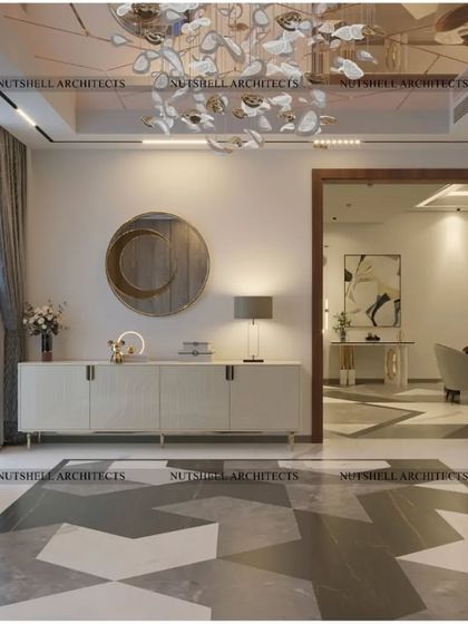 Another view of the foyer, highlighting a sleek white console table and a modern circular mirror. This area provides a stylish and functional space for welcoming guests and setting down essentials.