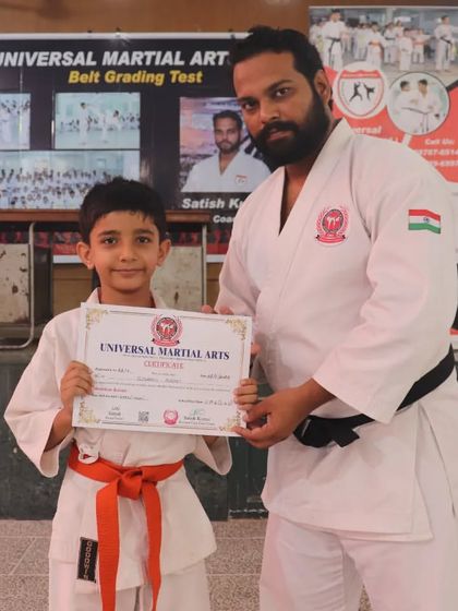This young student was very happy to receive his orange belt certificate. Seeing the pride on their faces is the best reward for a coach.