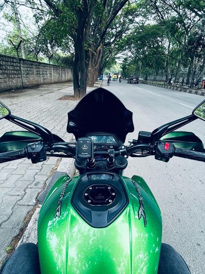 The cockpit view from a green Dominar 400. This is our office, where we feel most at home.