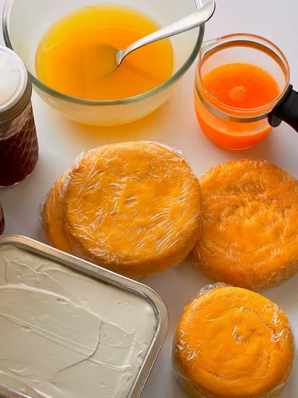 Behind the scenes of my flavor of the month. Freshly baked orange cake layers, homemade orange curd, and silky buttercream, all ready to be assembled.