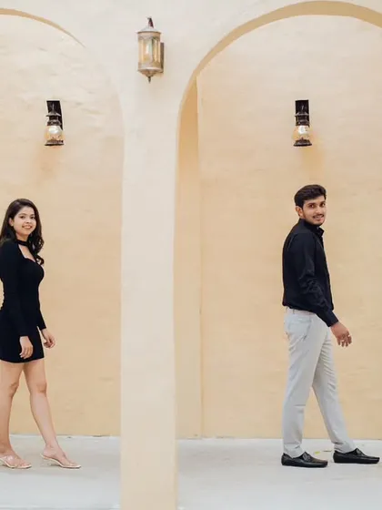 Sometimes, simplicity is the most elegant. For this couple's photoshoot, we used a minimalist arched hallway to create a clean, modern, and sophisticated look. This style is perfect for capturing candid, natural interactions.