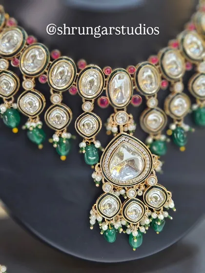 A detailed shot of the necklace, showing the beautiful combination of Kundan work and sparkling AD stones.