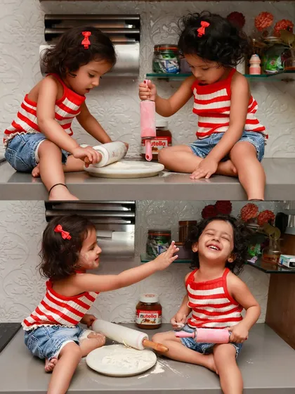 The best moments often happen right at home. This candid shot of two sisters "baking" in the kitchen is from a lifestyle family shoot. I love capturing the beautiful, messy, real-life chaos that makes your family unique.