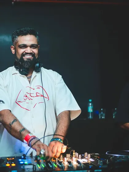 A smiling shot from behind the decks, ready for a big Christmas weekend of gigs.