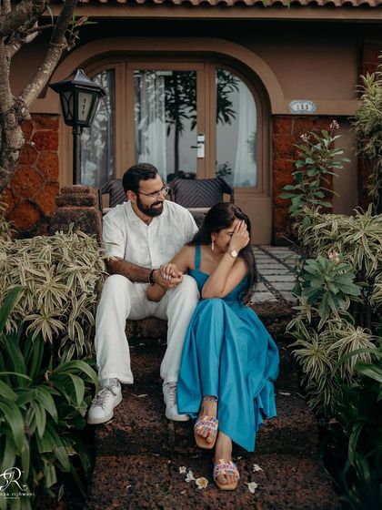 Sometimes the best moments happen when you think no one is watching. A shy laugh and a gentle hand-hold on the steps of their resort in Goa make for a perfectly candid photograph.
