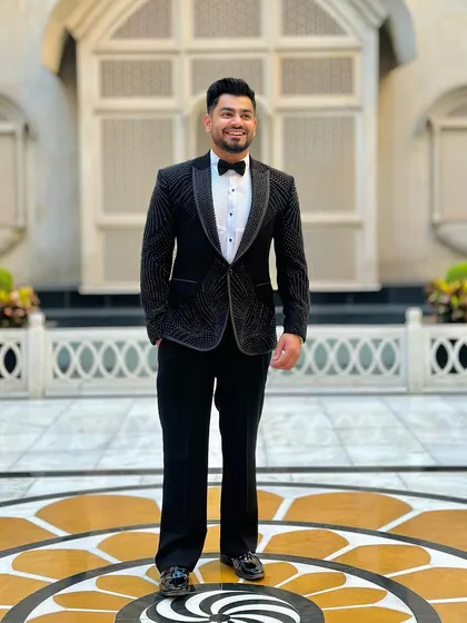 It was an honor to wear one of my own creations at the IIFA Awards. This black tuxedo with abstract silver embroidery is designed for making a statement on the red carpet or at any grand celebration.