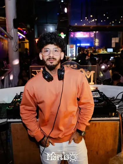 A casual shot of me at the DJ booth at Cafe Mambo. Even during the most intense parties, I maintain a calm and focused presence.