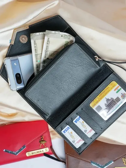 My personalized ladies' clutch is designed for both style and function. As you can see, it's spacious enough to hold your phone, cash, and multiple cards, making it the perfect everyday accessory.
