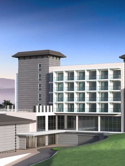 A render for a proposed 70-key boutique hotel nestled in a hilly landscape. The design features clean lines and terraced levels that follow the natural contour of the land, maximizing views and minimizing environmental impact.