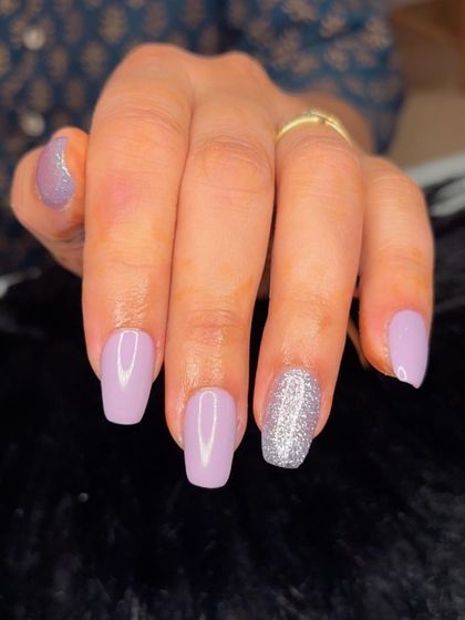 Lavender sparkle nails for Diwali, with a mix of solid lavender and full silver glitter accent nails.