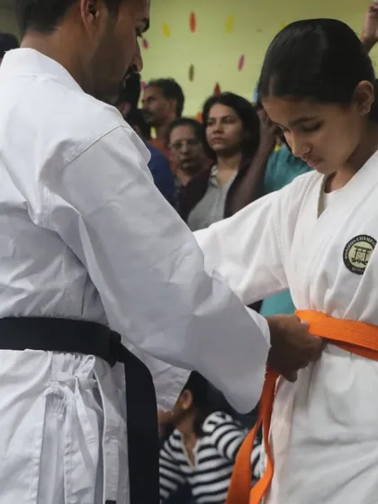 A significant moment for every student. Here, I am awarding a new belt, which is a symbol of their hard work, dedication, and progress on their karate journey.