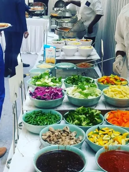 A vibrant pasta station with a variety of fresh vegetables, sauces, and pasta types. This allows guests to create their perfect pasta dish, cooked to order by my chefs.