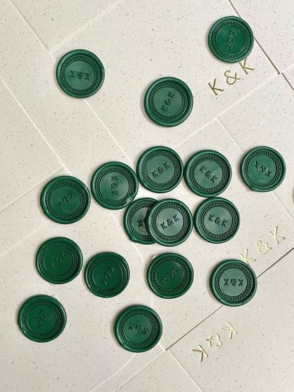 A scattering of the emerald green wax seals. I can create these in any color to perfectly match your invitation suite, providing a beautiful and traditional finishing touch.