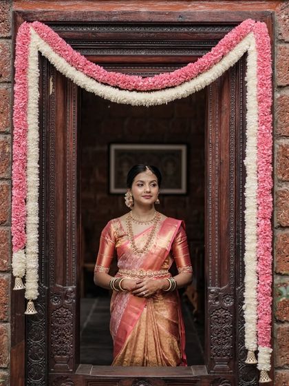 A solo portrait of the bride, looking elegant and serene. The makeup is timeless, ensuring her wedding photos will never look dated.