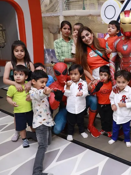A big group photo with both Spiderman and Iron Man. Having two heroes at the party doubles the excitement for the kids.