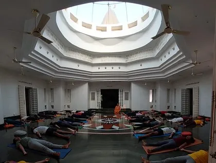 Proper relaxation is as important as proper exercise. Students practice Savasana in a beautiful hall in Gurgaon, absorbing the benefits of their asana practice under my guidance.