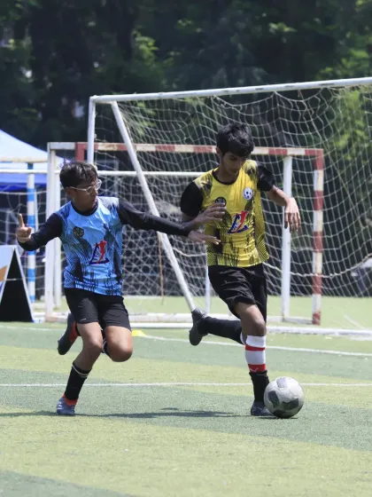 A player from our U-15 team makes a run down the wing during the semi-final, looking to create a scoring opportunity. His focus and determination are clear.