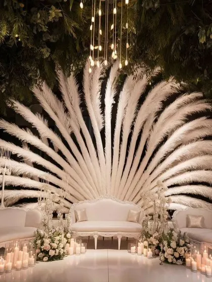 For a modern and chic reception, I designed this stunning stage using pampas grass and elegant lighting. This shows my ability to work with contemporary wedding decor trends to create a unique look.