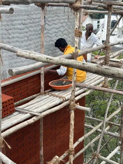 Brick by brick. A mason carefully lays wire-cut bricks on an exterior wall. Achieving the perfect brick aesthetic requires immense care and craftsmanship, which we oversee closely on site.