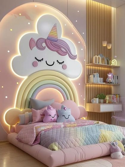 An elaborate custom bed with a large, cloud-shaped headboard featuring a unicorn and rainbow. The entire bed frame is low and padded, making it safe and fun for a child.