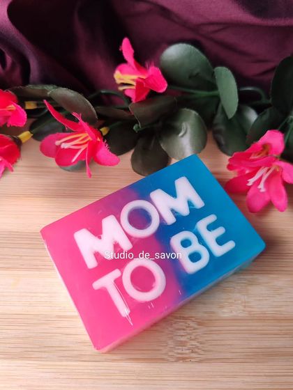 A simple and direct way to celebrate the "Mom to Be". This handmade soap features a fun pink and blue swirl, making it a perfect gift for the guest of honor at her baby shower or as a standalone present.