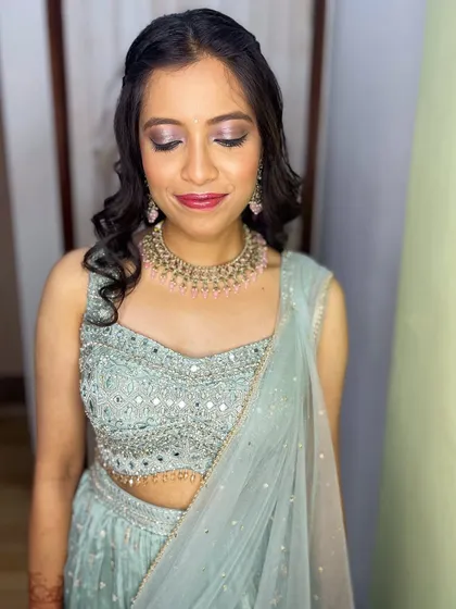 Another view of the makeup, showing how the light catches the shimmer on her eyelids.